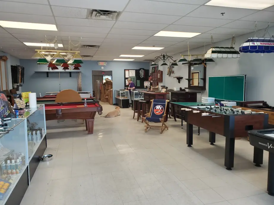 The Newburgh showroom floor: pool tables, foosball tables, billiard lights and the glass counter